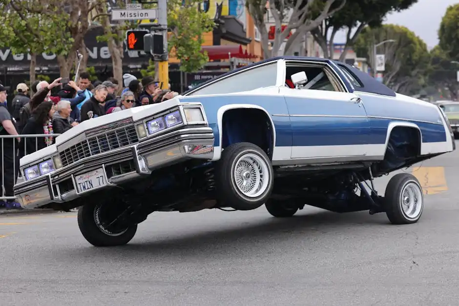 People Watching a Lowrider Cadillac on the Street