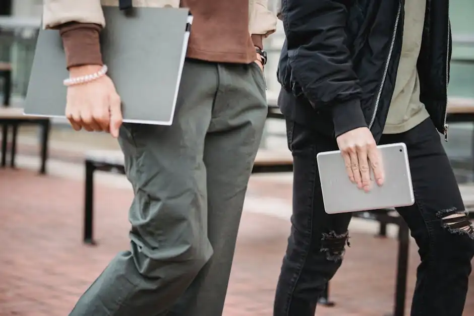 Crop men with tablet and folder