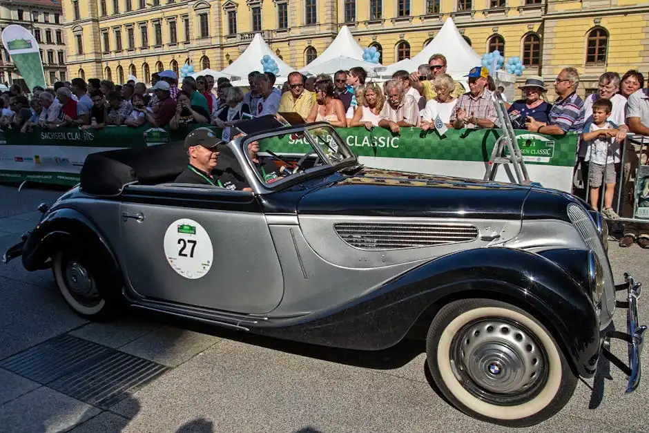 Two People Riding a Classic Car