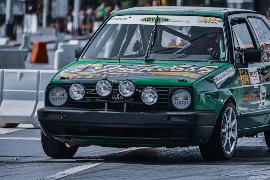 Green vintage rally car racing on city streets showcasing speed and agility.